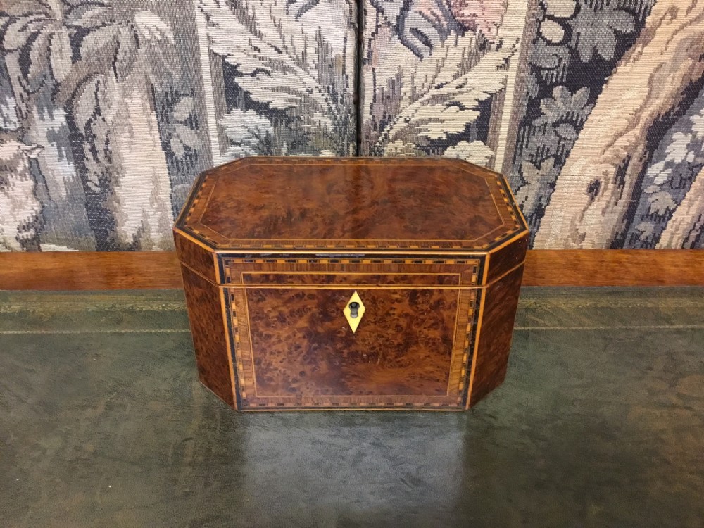 A Georgian Period hexagonal thuya wood inlaid tea caddy