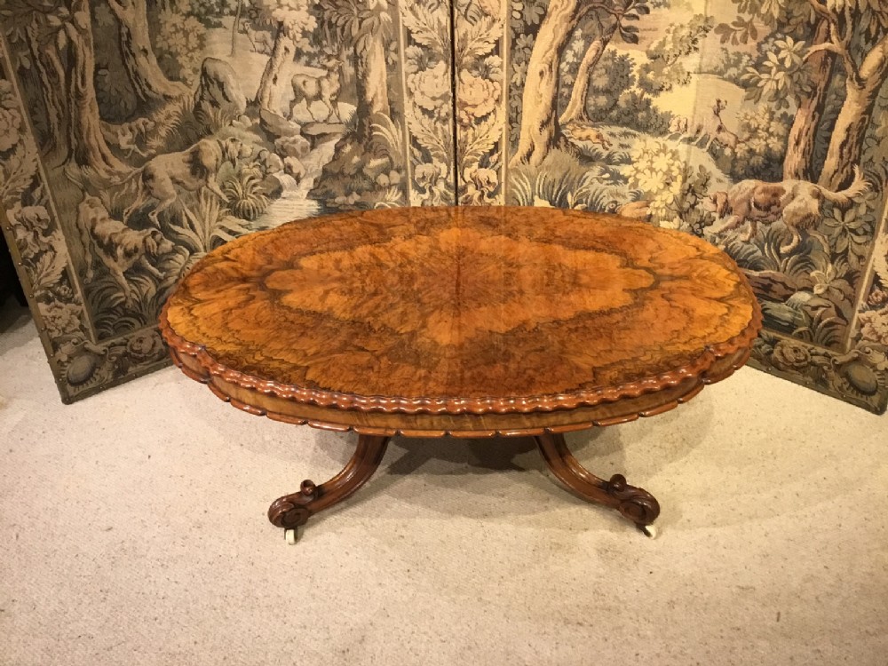 A stunning burr walnut Victorian Period shaped coffee table