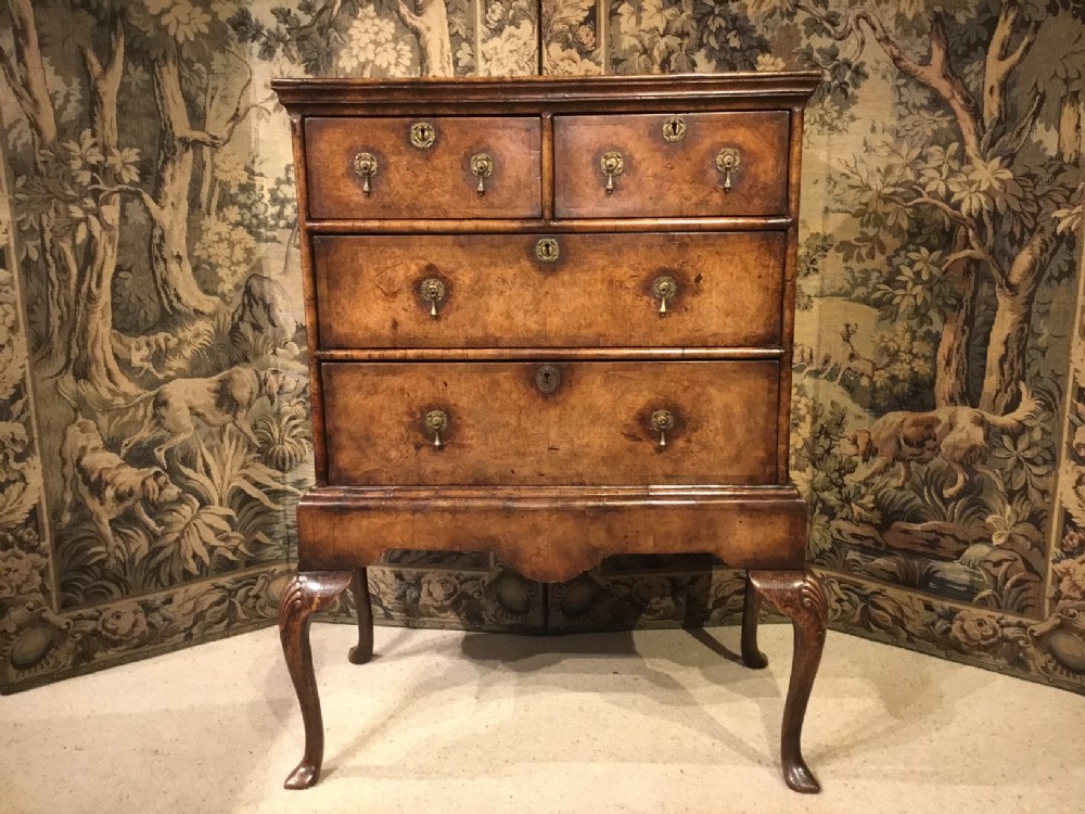 A burr walnut Queen Anne Style chest on stand