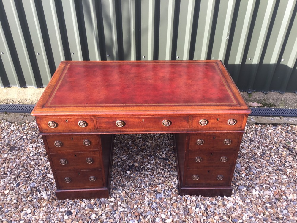 A Victorian Period oak antique pedestal desk.
