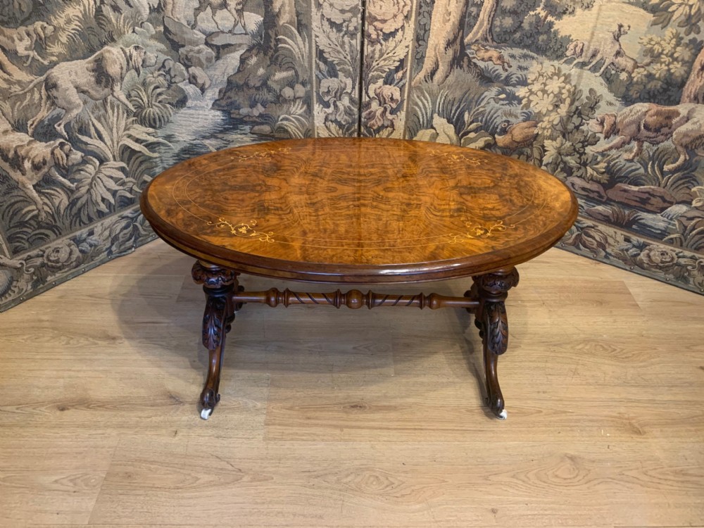 A Victorian Period burr walnut marquetry inlaid antique coffee table.