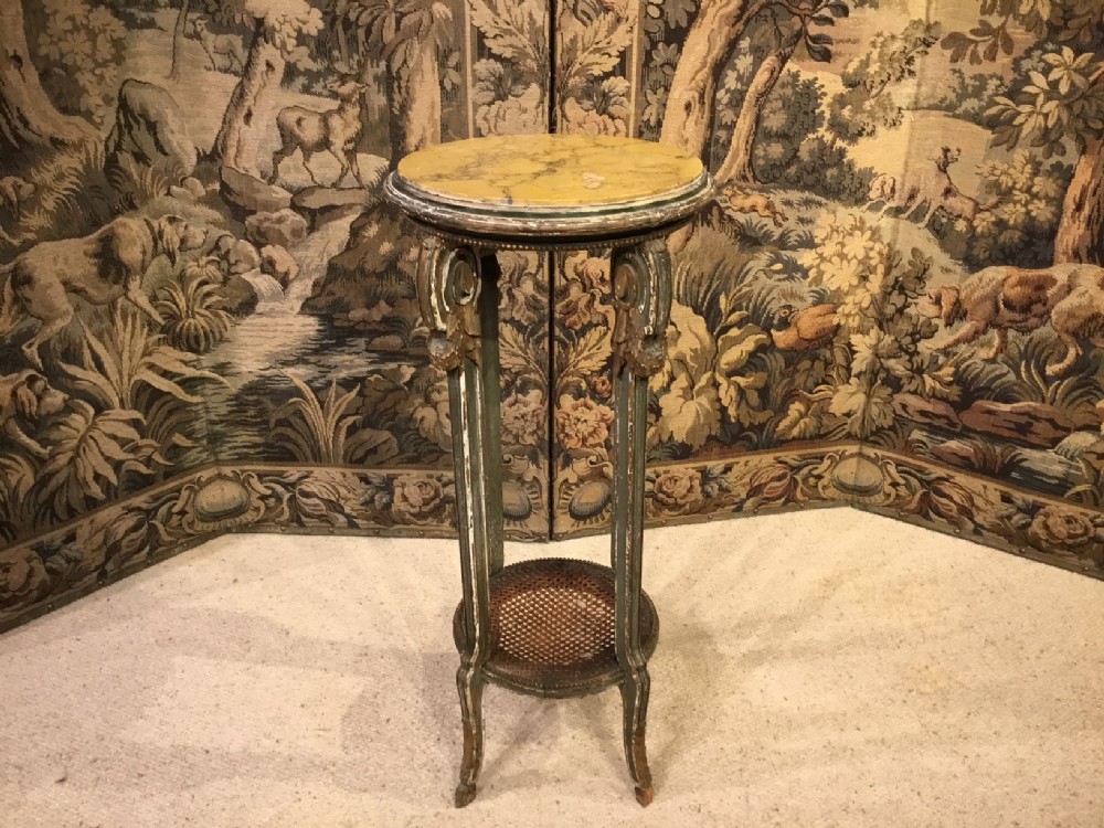 A French gilded and painted marble topped jardiniere stand