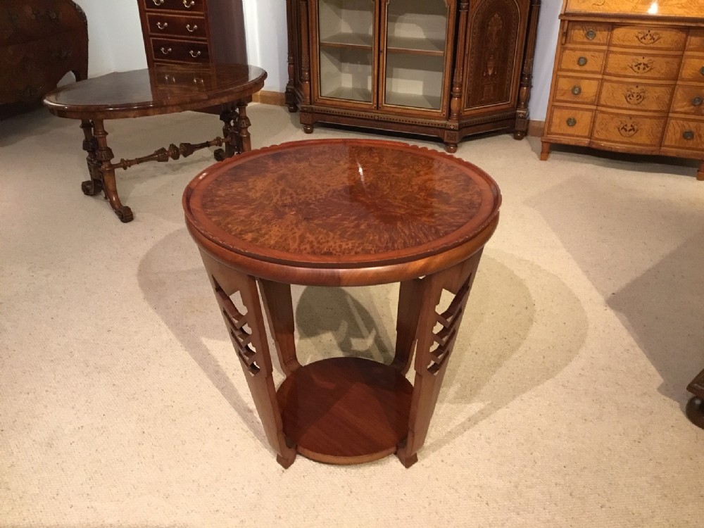 A circular mahogany and burr yew Art Deco Period occasional table