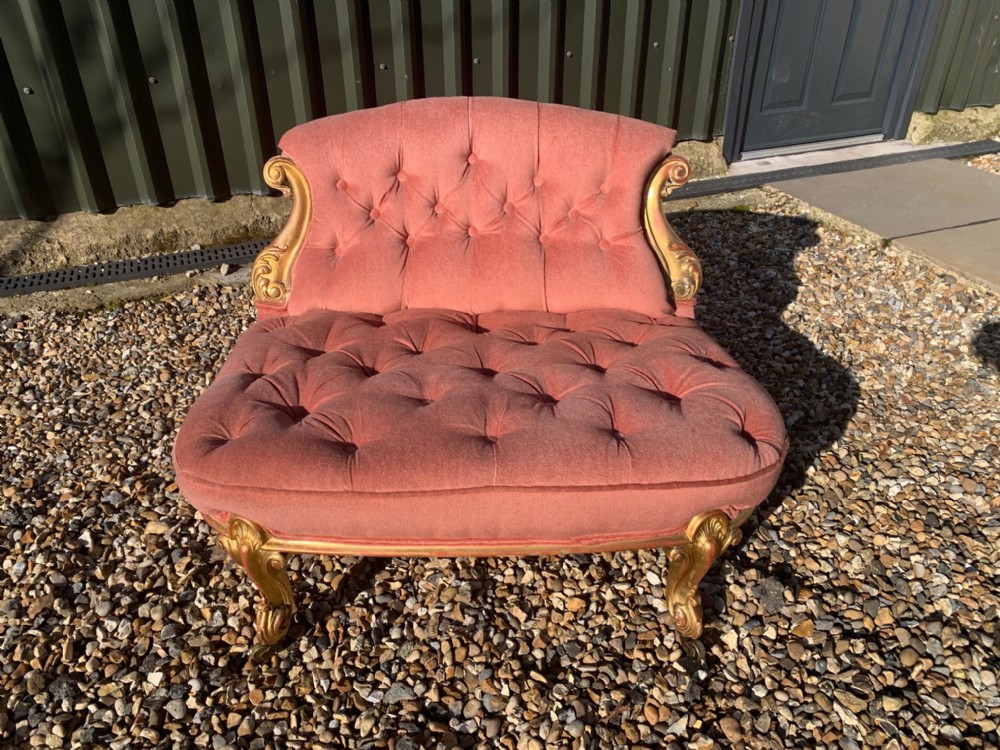 A rare Victorian Period carved gilt wood antique love seat