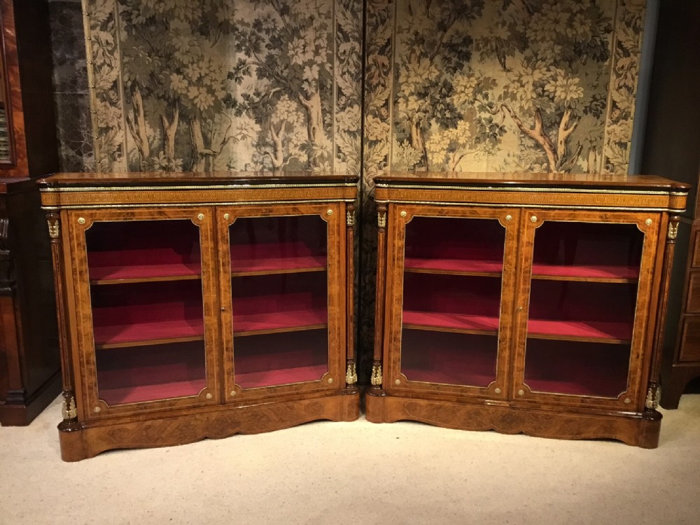  A superb pair of Victorian Period burr walnut & ormolu mounted pier cabinets.