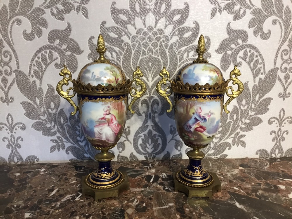 A fine quality pair of French Sevres porcelain vases with covers