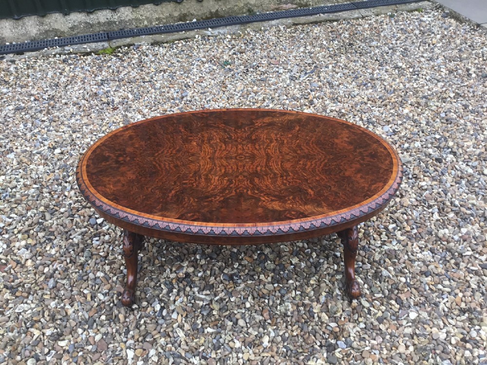A fine quality Victorian Period burr walnut oval antique coffee table
