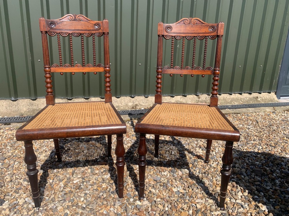 A pair of Regency Period rosewood hall chairs