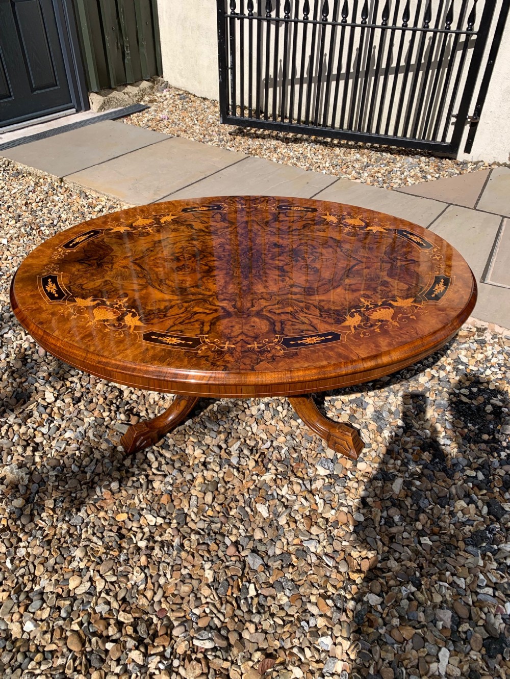 A Victorian Period oval marquetry and burr walnut antique coffee table