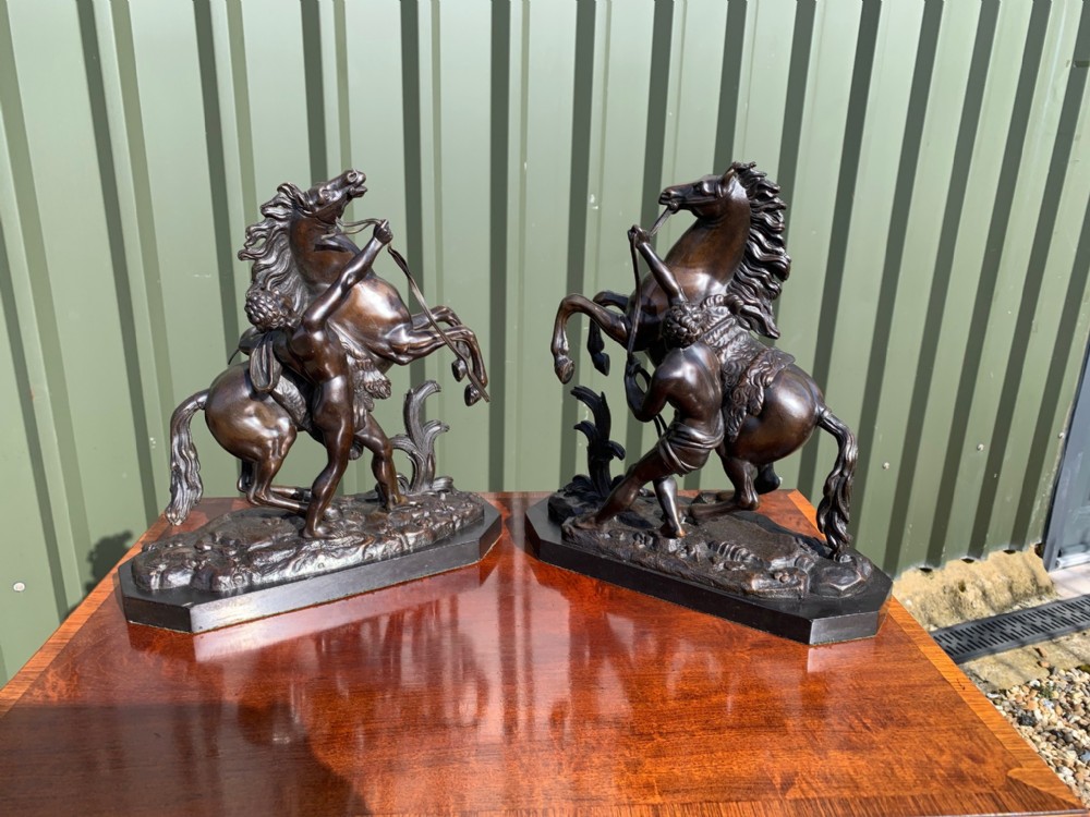 A pair of French Classical 19th Century bronze Marley horses