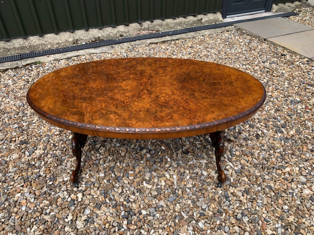 A Victorian Period oval burr walnut antique coffee table
