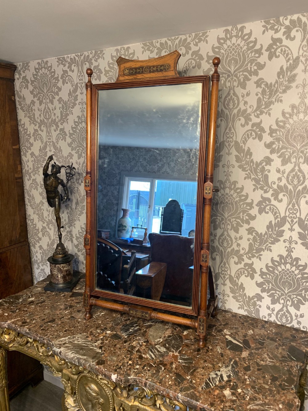 A Fine Regency Period mahogany and brass inlaid easel mirror