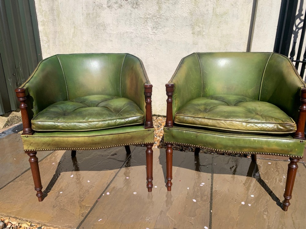 A fine quality pair of mahogany and green leather desk chairs