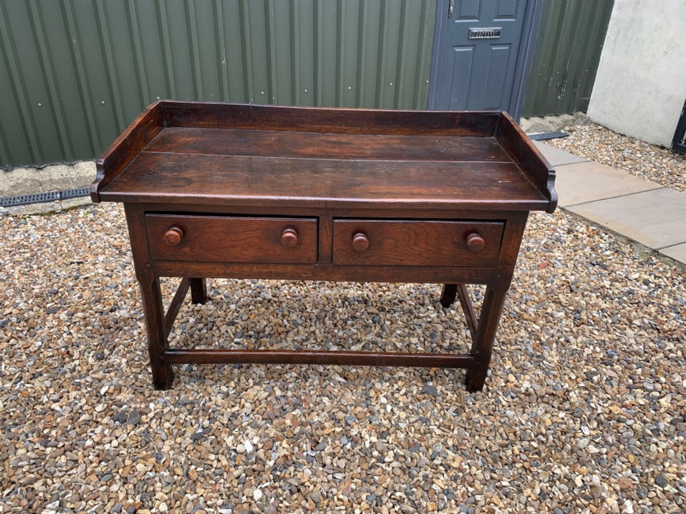 A wonderful 18th Century Welsh two drawer dairy table.