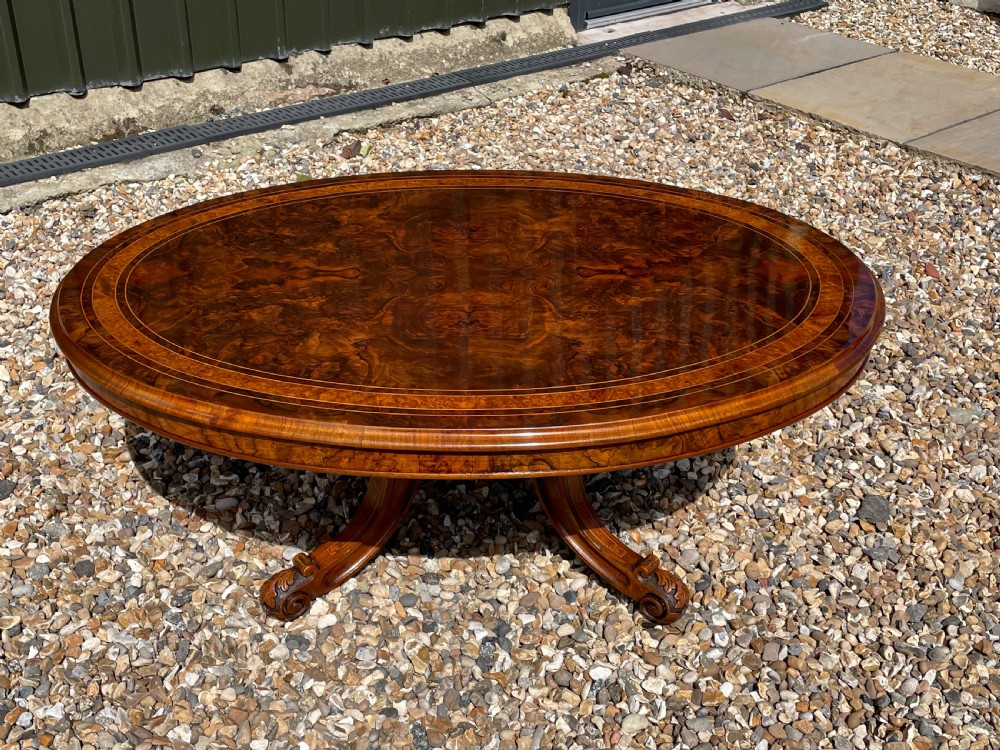 A Victorian Period oval burr walnut antique coffee table