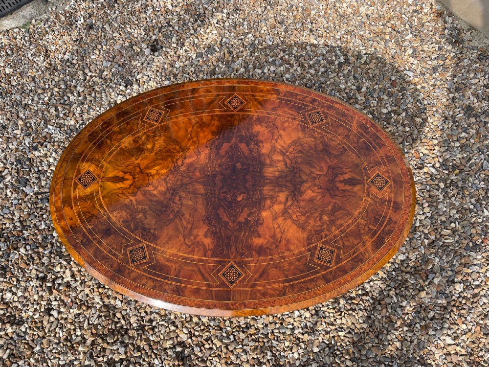 A Victorian Period oval burr walnut antique coffee table View XV