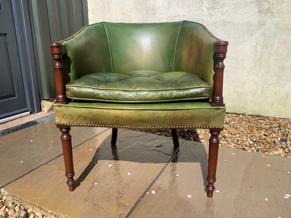 A fine quality mahogany and green leather desk chair