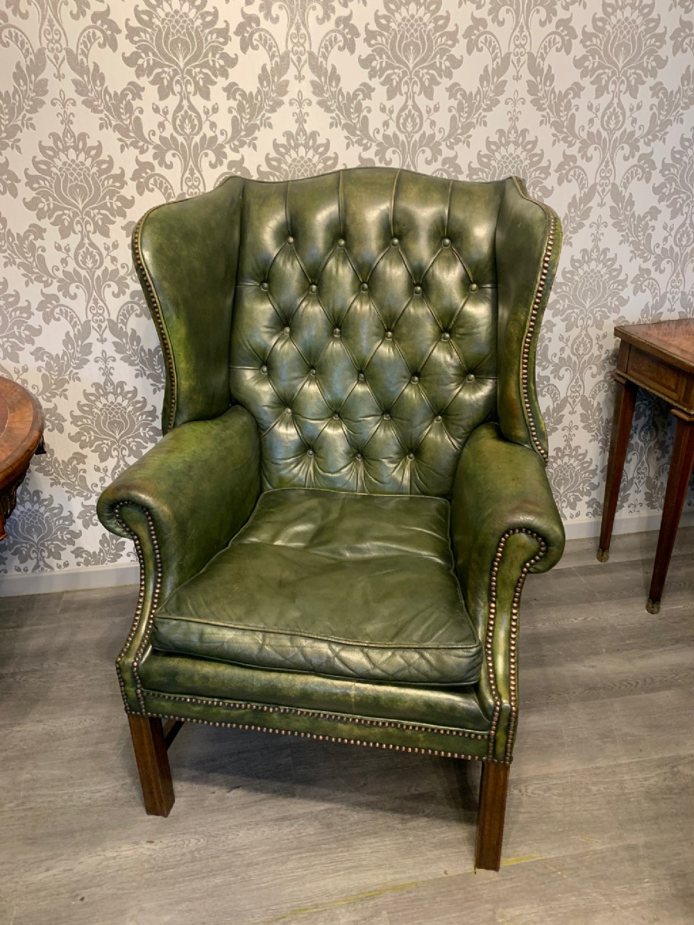 A George III Style leather wing armchair 