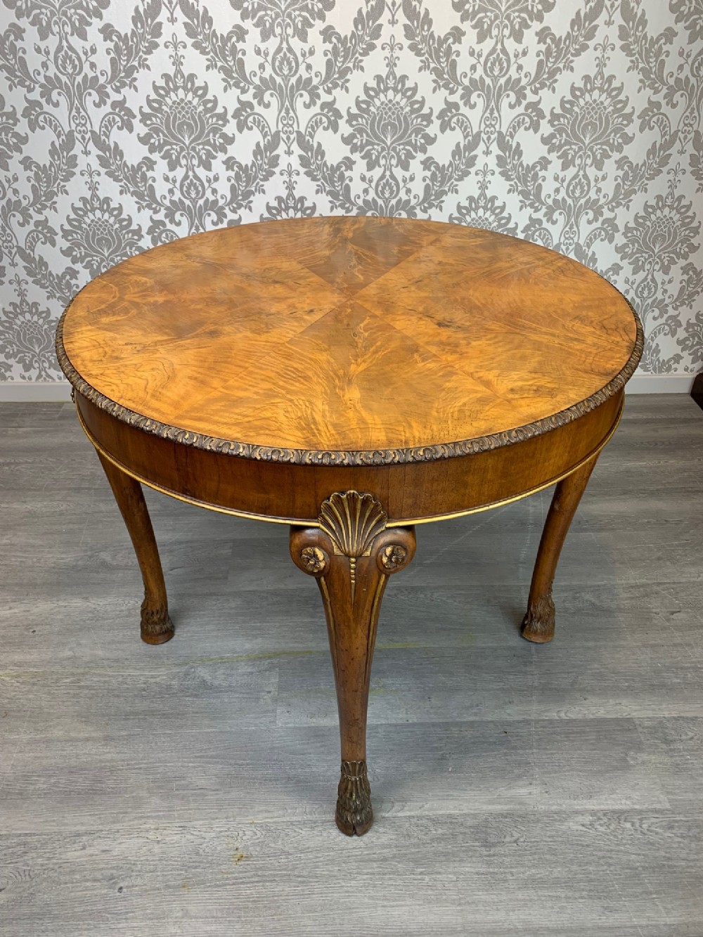 A fine quality Georgian Revival walnut and parcel gilt centre table