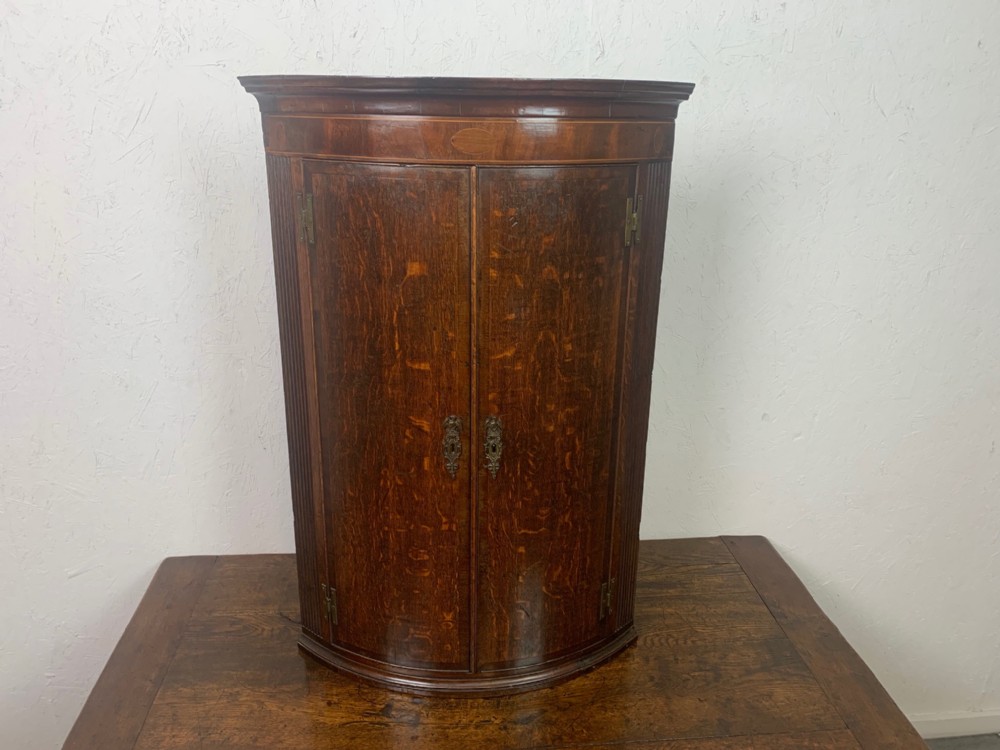A Lovely George III Period oak and mahogany antique corner cupboard