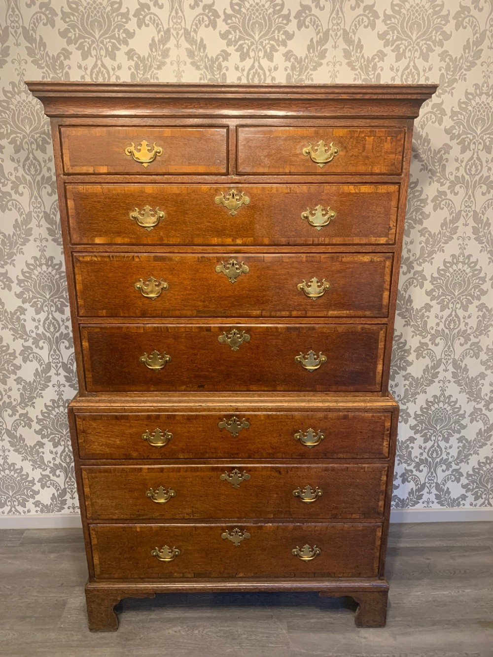 An oak and walnut banded George III Period antique chest on chest.