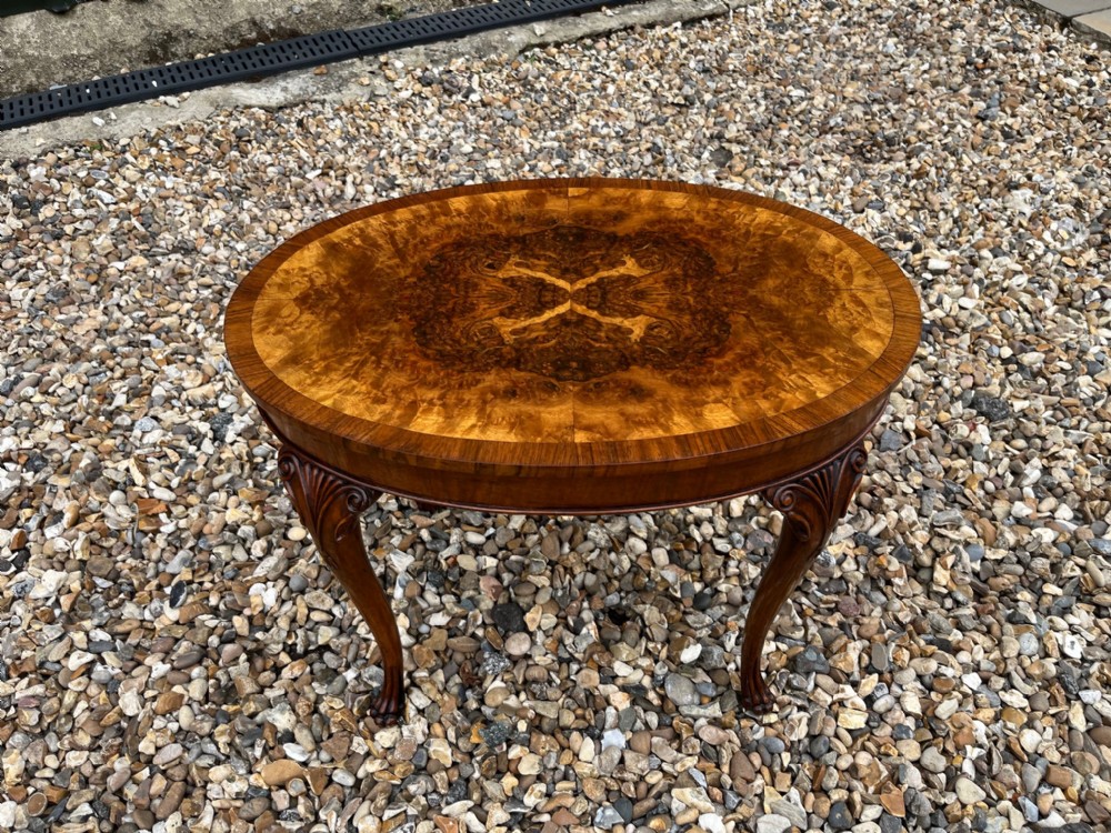 A small Oval burr walnut Queen Anne Revival coffee table