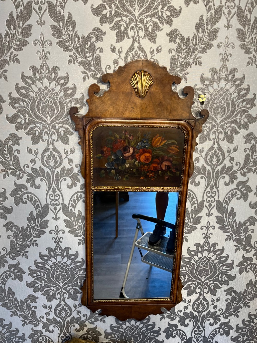 A George I Revival walnut wall mirror.