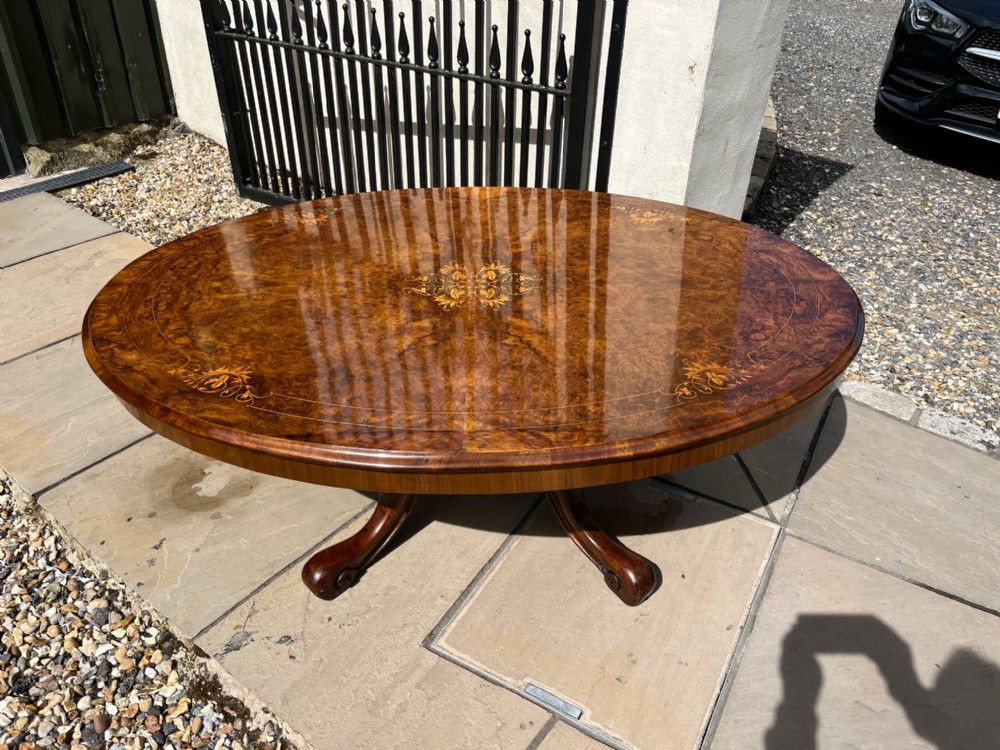 A lovely large Victorian Period oval burr walnut antique coffee table.