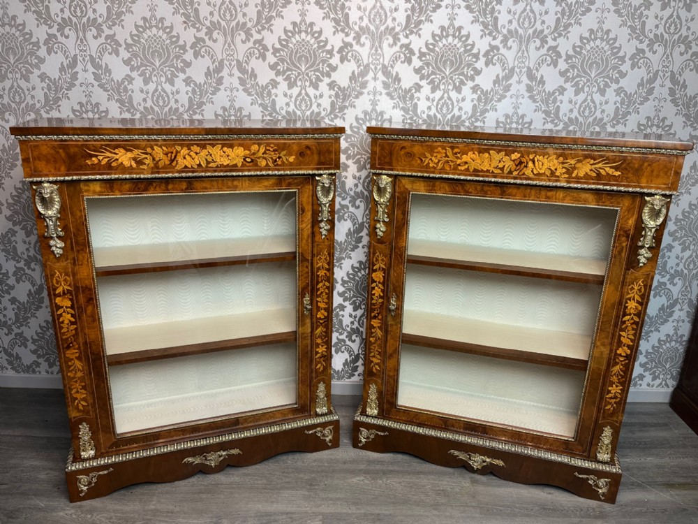 A stunning and rare pair of Victorian Period burr walnut pier cabinets