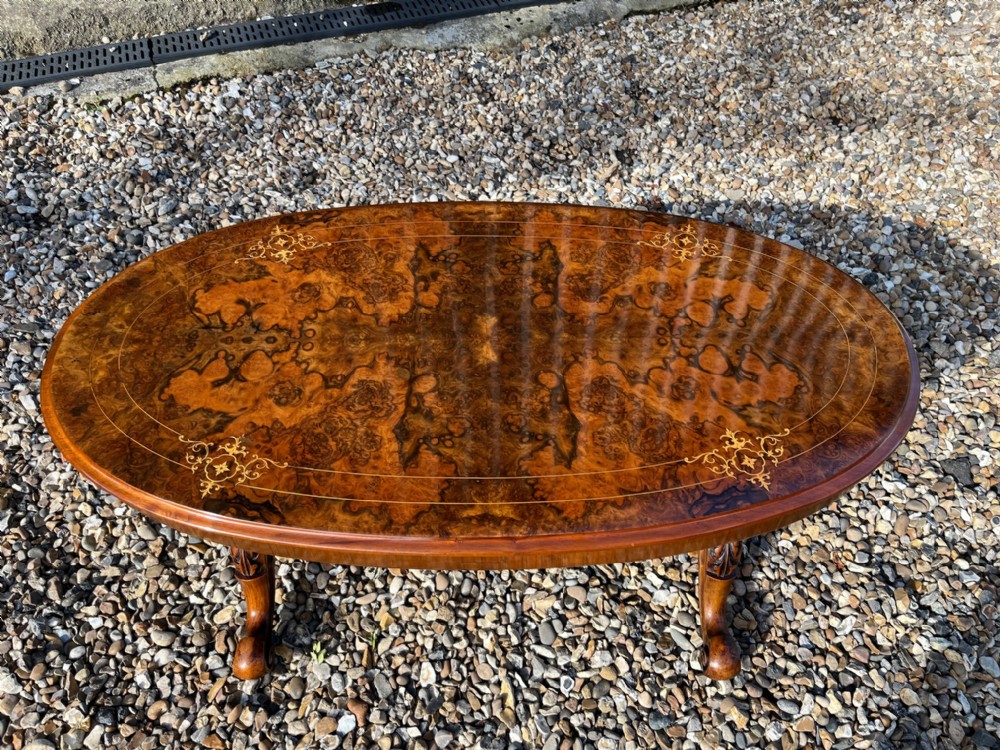 A fine quality Victorian Period burr walnut oval coffee table