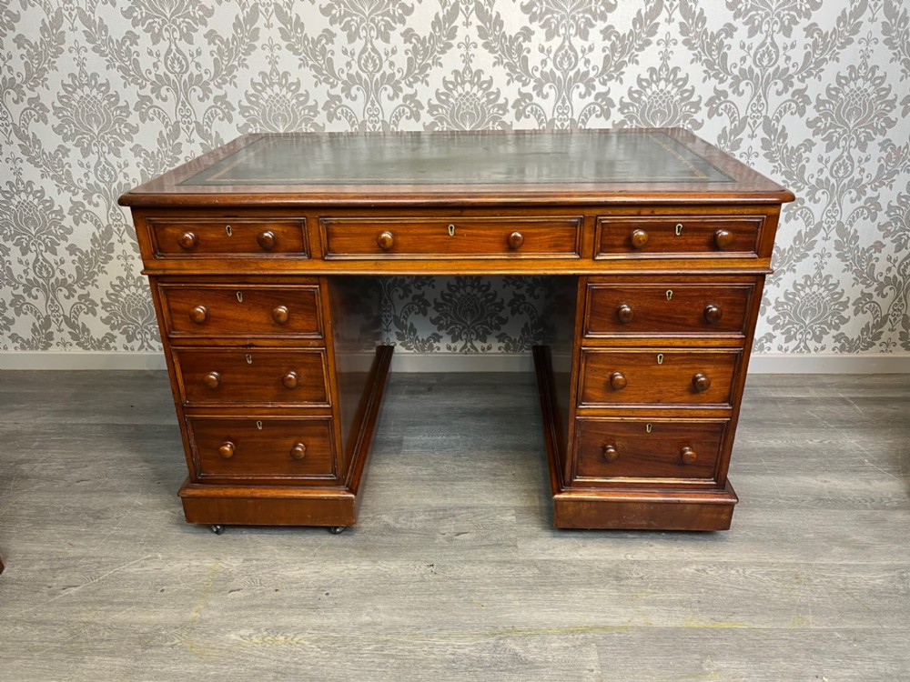 A Victorian Period mahogany three part antique pedestal desk