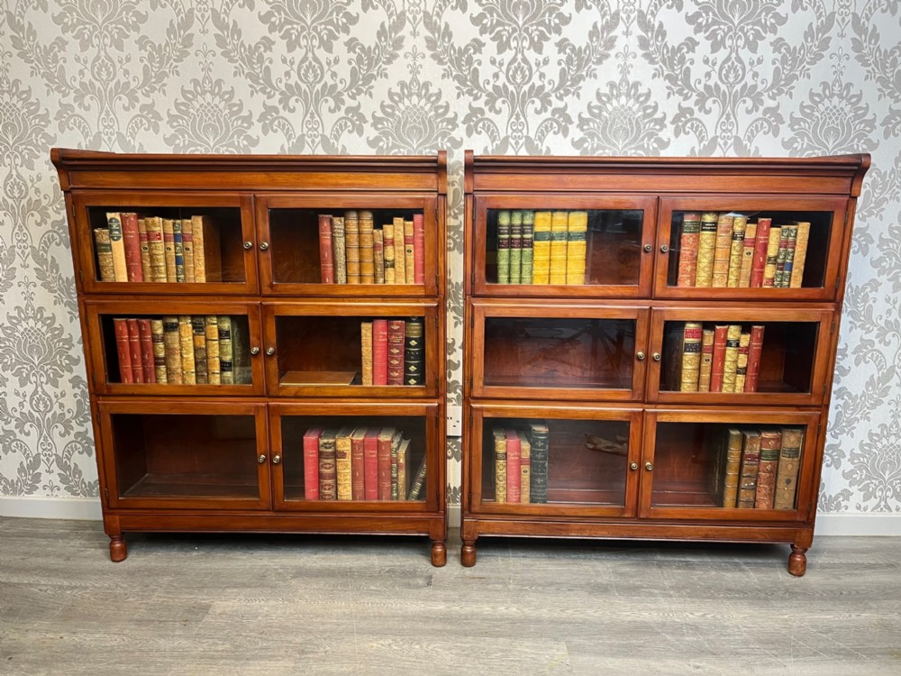 A good quality pair of mahogany barristers sectional bookcases by Minty's Of Oxford