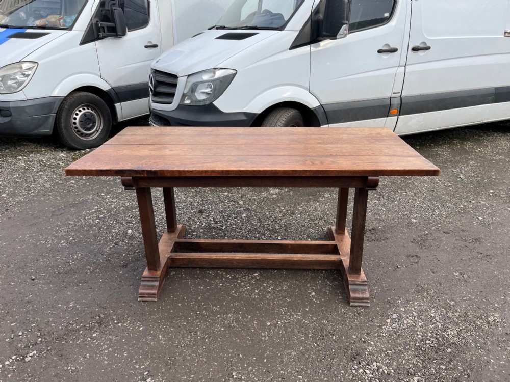 A good 1920s Cotswold school oak dining table