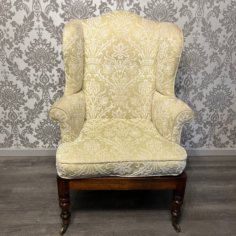 A Mid 19th Century mahogany antique winged armchair