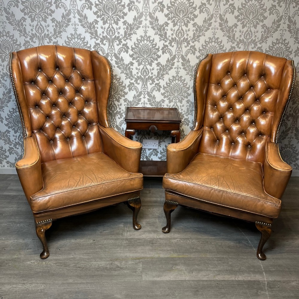 A good pair of Edwardian Period Georgian Style leather wing armchairs