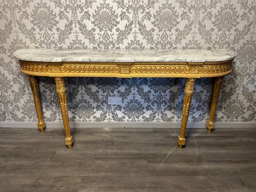A large French 19th Century gilt wood antique console table