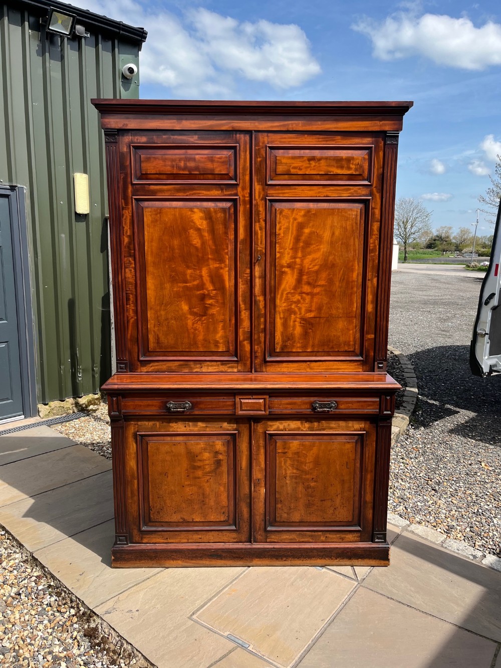A large scale figured mahogany Scottish Estate Cupboard