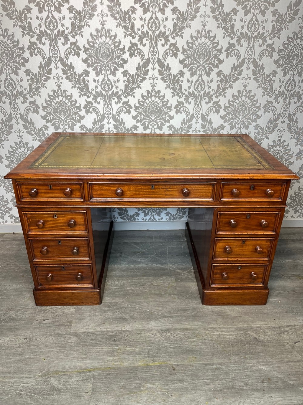 A small Victorian Period mahogany antique pedestal desk
