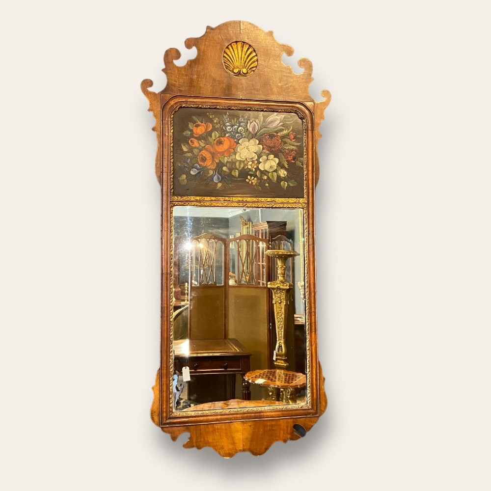 A Queen Anne Revival walnut wall mirror.