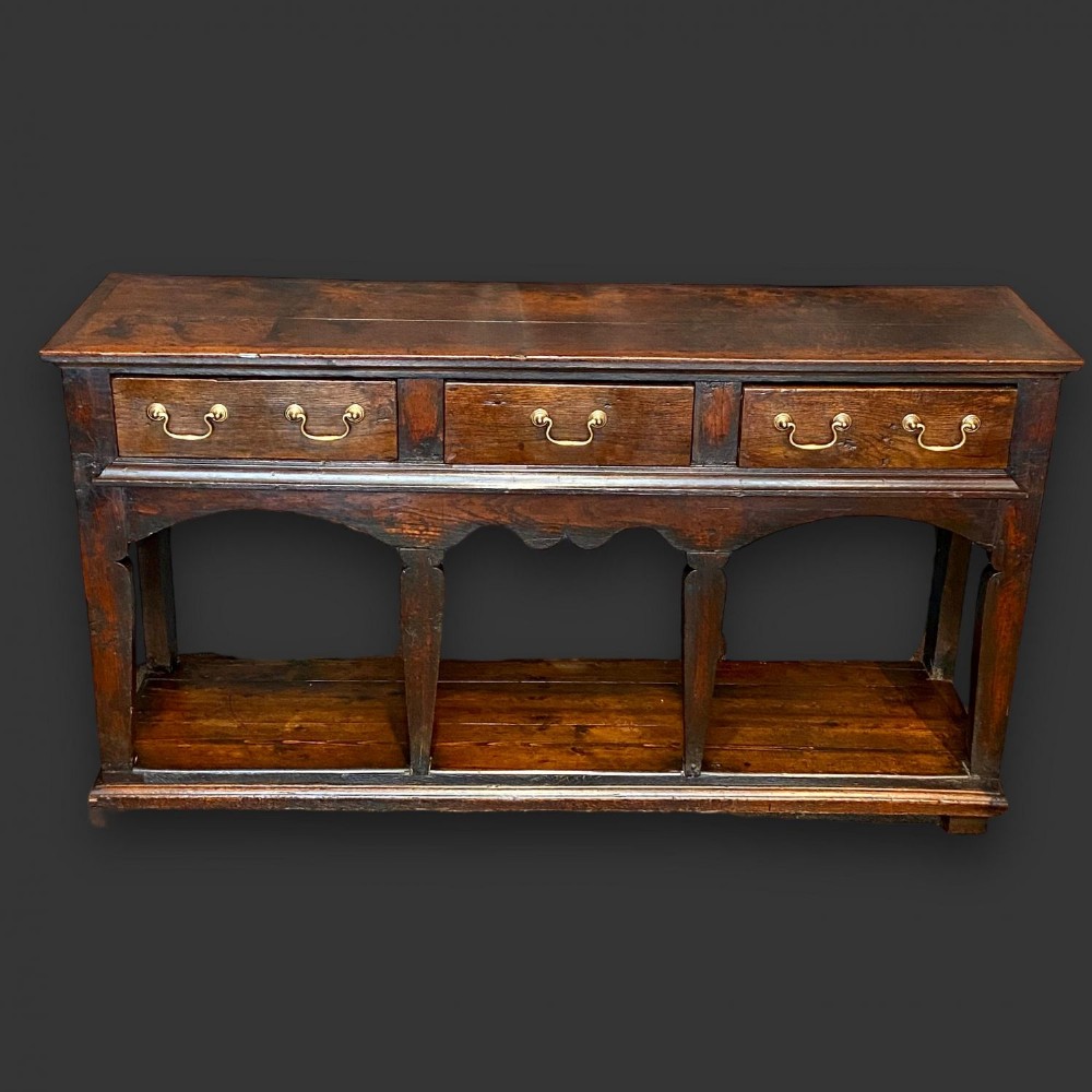 An 18th Century three drawer oak dresser base