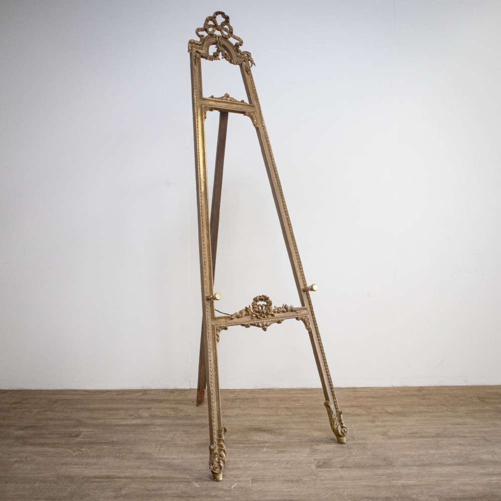 An Antique French carved gilt wood and gesso easel.