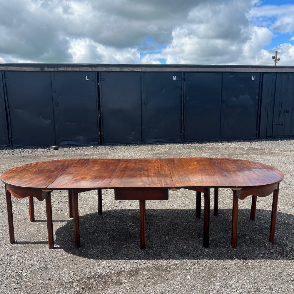 A George III Period mahogany D end dining table