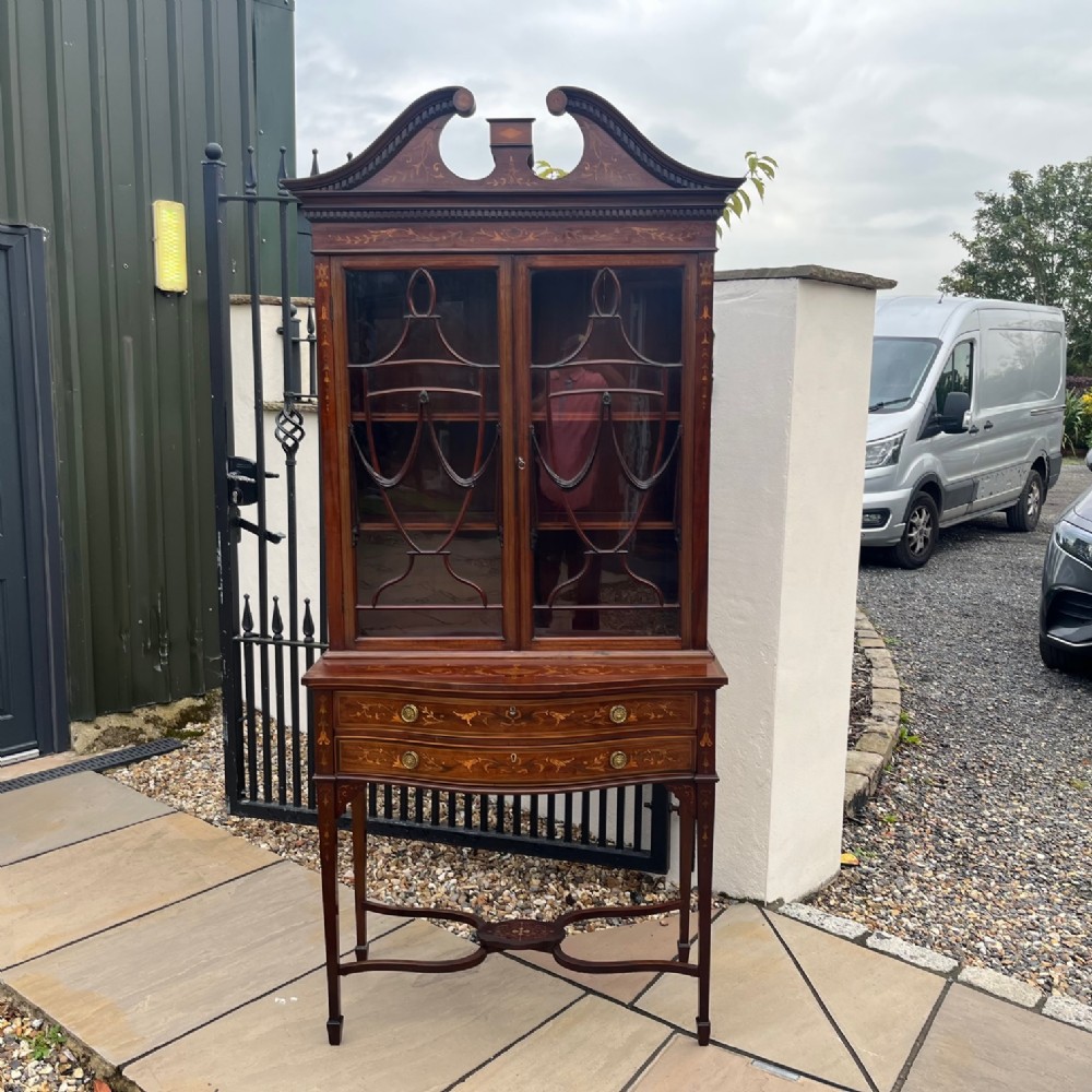 A fine quality Edwards and Roberts marquetry inlaid cabinet