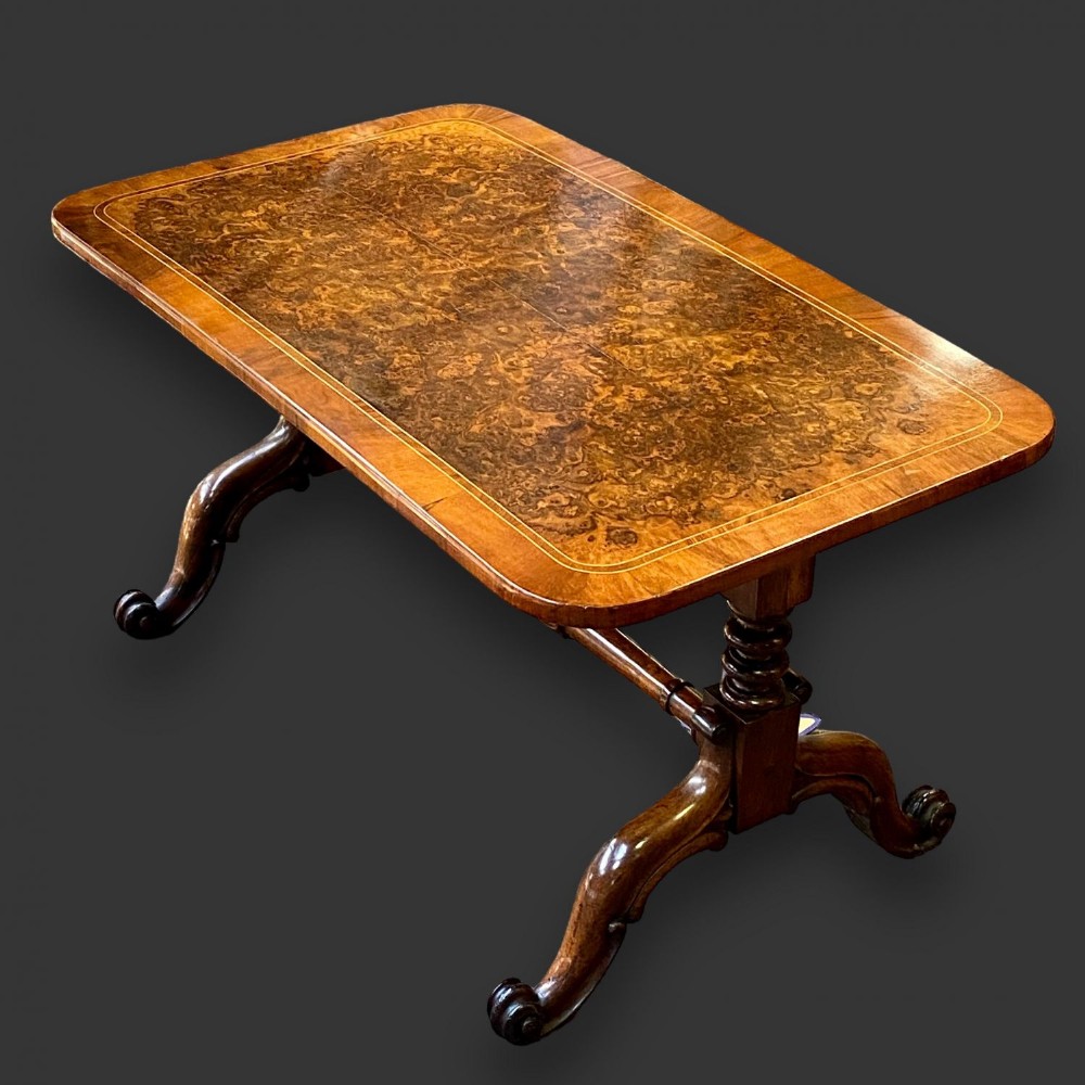 A burr walnut and mahogany antique coffee table