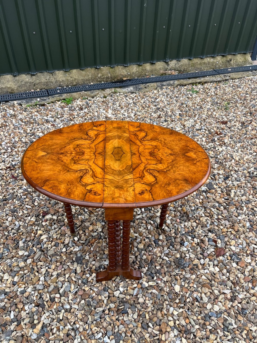A Victorian Period figured walnut baby Sutherland table