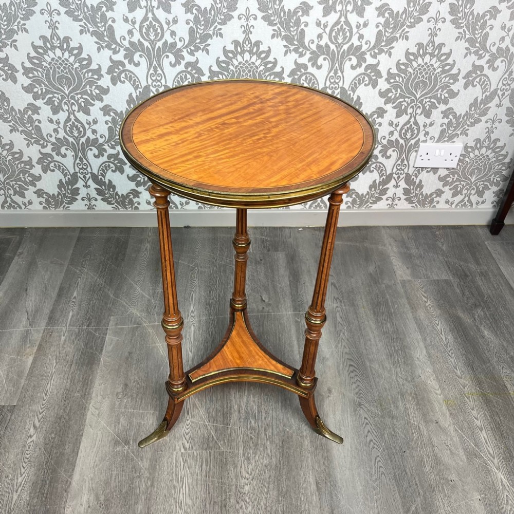An elegant fine quality 19th Century satinwood and brass mounted wine table
