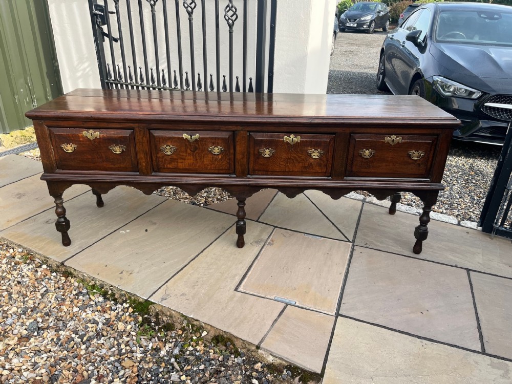 A large scale George III Period oak antique dresser base