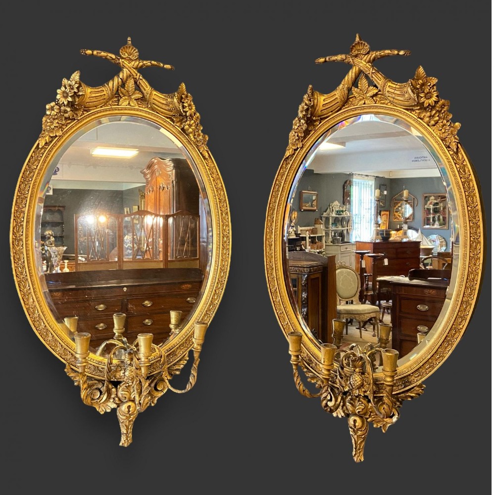 A pair of fine quality French carved gilt wood and gesso girandoles