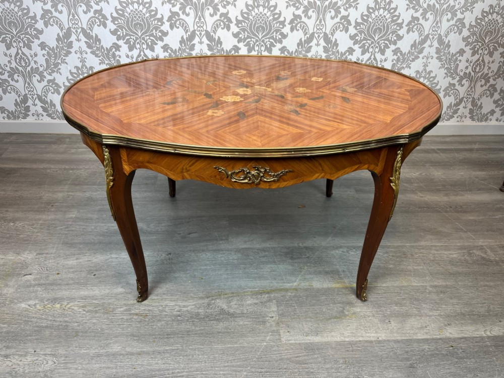 A French kingwood and brass mounted coffee table