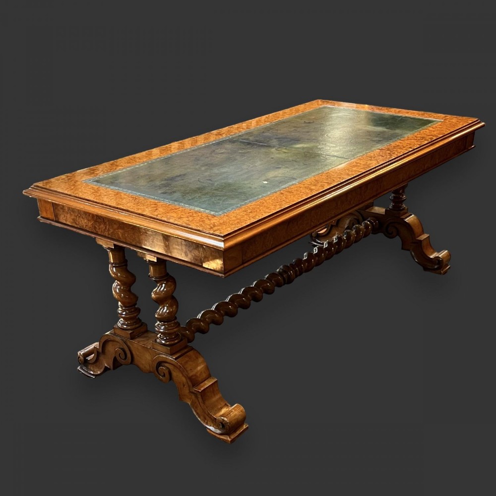 A Victorian Period amboyna and leather topped coffee table by Miles and Edwards of London